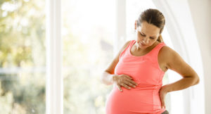 Колика у беременной в животе